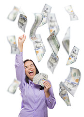 Image showing Happy Woman Holding the $100 Bills with Many Falling Around