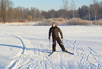 Image showing Boy cross country skiing at sunny winter day