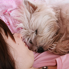 Image showing Dog sleeping on bed 