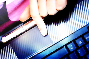Image showing Working at laptop .