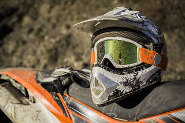 Image showing Dirty motorcycle motocross helmet with goggles