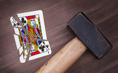 Image showing Hammer with a broken card, jack of clubs