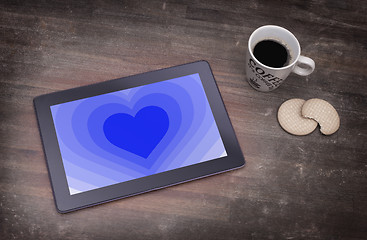 Image showing Heart shape backgound on tablet