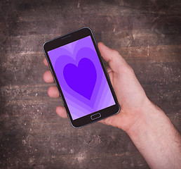 Image showing Heart shape backgound on tablet