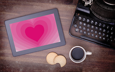 Image showing Heart shape backgound on tablet