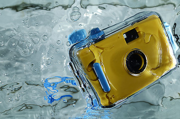 Image showing Photo of yellow waterproof camera in water with splash.