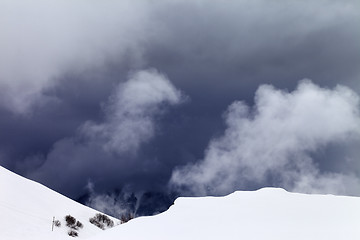 Image showing Off-piste slope and storm gray clouds