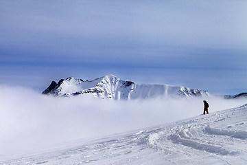 Image showing Snowboarder on off-piste slope with newly fallen snow