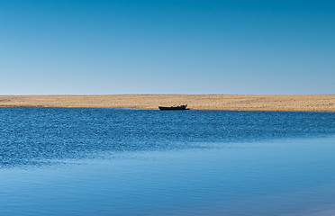 Image showing Solo Rowboat Moored on Sandy Beach