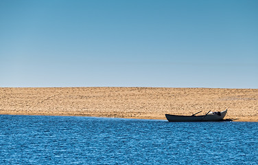 Image showing Solo Rowboat Moored on Sandy Beach