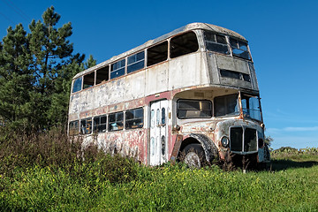 Image showing Rusty Abandoned Double-Decker Bus Standing in a Field