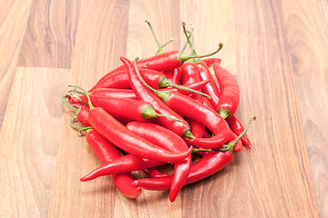 Image showing Red chili on wooden board