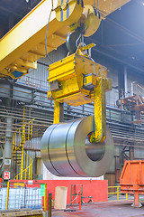 Image showing crane loading of metal 