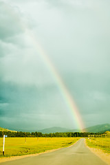 Image showing Rainbow above road in Mountain Altai. Russia