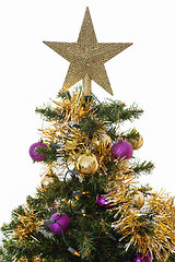 Image showing Decorated christmas tree with yellow and violet balls