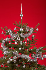 Image showing Decorated christmas tree on red background