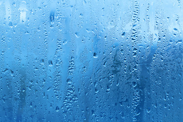 Image showing Natural water drops on glass