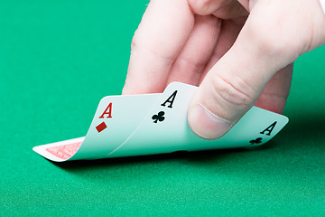 Image showing card player. Male hand with cards