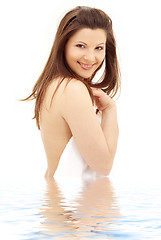 Image showing lovely brunette with white towel in water