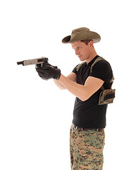 Image showing Soldier pointing a pistol.