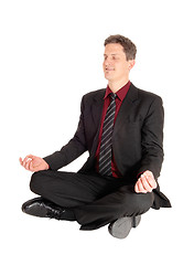 Image showing Businessman doing yoga.