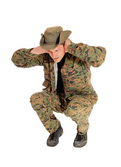 Image showing Soldier crouching on floor.