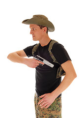 Image showing Soldier pulling his handgun.