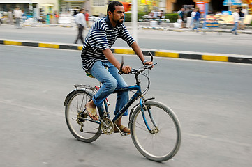 Image showing Man goes by bicycle down street of Hurghada
