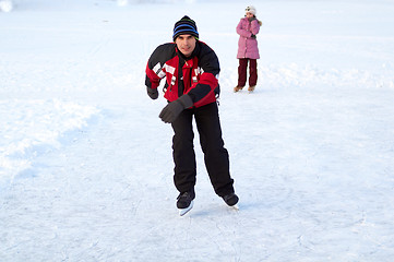 Image showing Happy family on skating rink outdoors