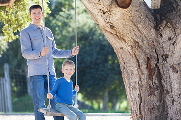 Image showing family at swings