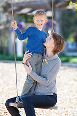 Image showing family at swings