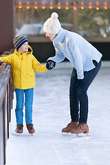 Image showing family ice skating