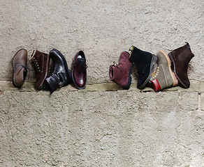 Image showing Set of man footwear on a grunge  background