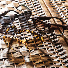 Image showing collection of colorful sunglasses on white background