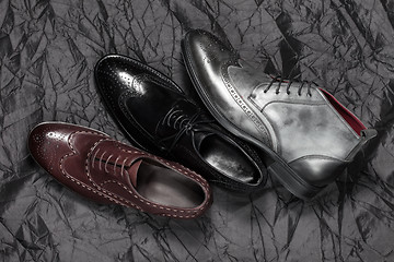 Image showing Set of man footwear on a black background