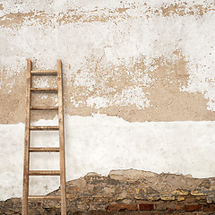 Image showing stucco wall with wooden ladder