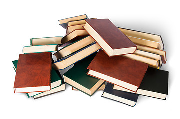 Image showing Piled on a bunch of old books top view