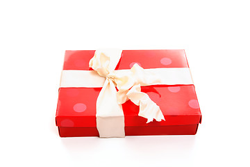 Image showing Red box tied with cream ribbon bow