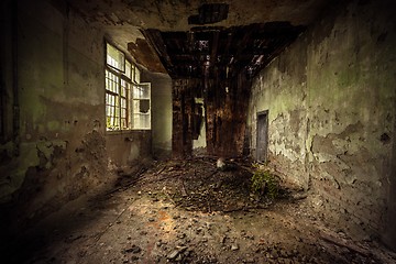 Image showing Dark room interior with damaged roof