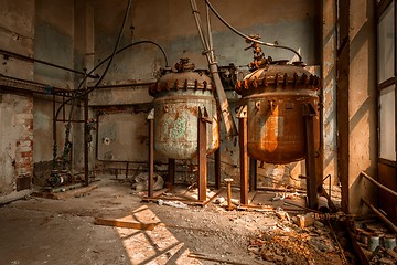 Image showing Industrial containers in abandoned interior