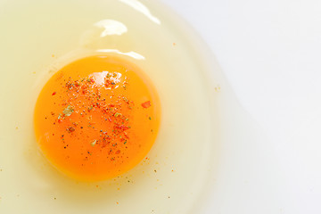 Image showing Egg yolk closeup on white