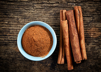 Image showing cinnamon powder and sticks