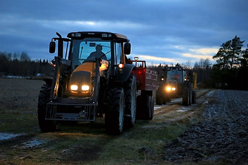 Image showing Two Agricultural Tractors on a Winter Night