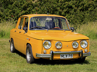 Image showing Yellow Renault 8S Car Parked on Grass