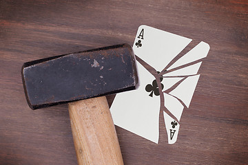 Image showing Hammer with a broken card, ace of clubs