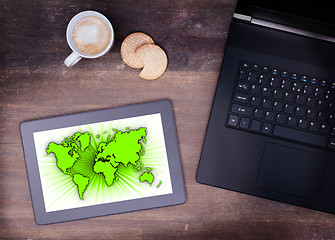 Image showing World map on a tablet