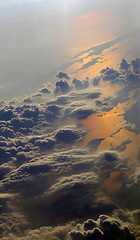 Image showing Earth view from above with clouds and sea reflections