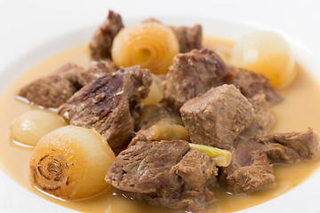 Image showing Lamb fricassee with onion macro