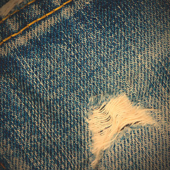 Image showing frayed blue jeans