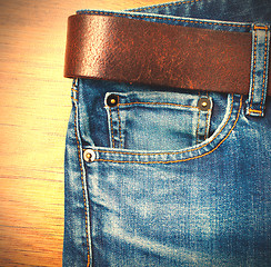 Image showing jeans with leather belt